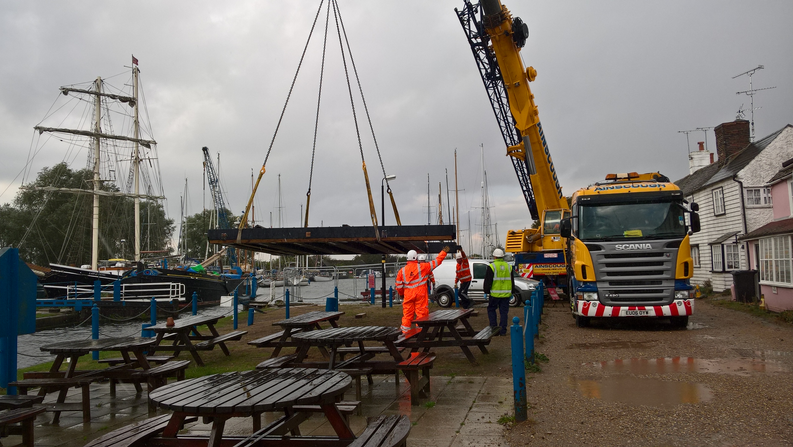 Crane lifting 1st timber gate into temporary position